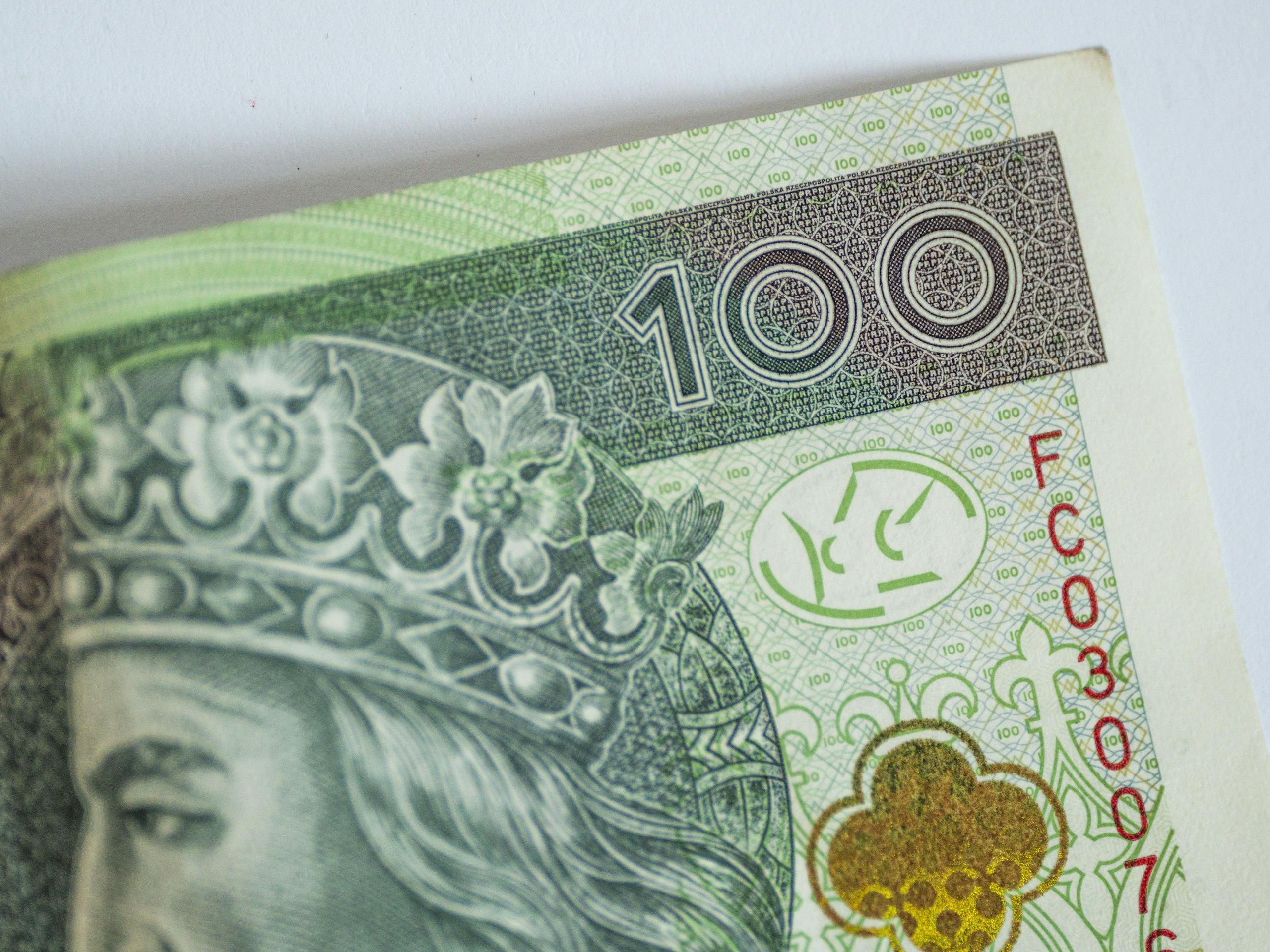 Detailed image of a Polish 100 Zloty banknote, showcasing intricate design and currency value.